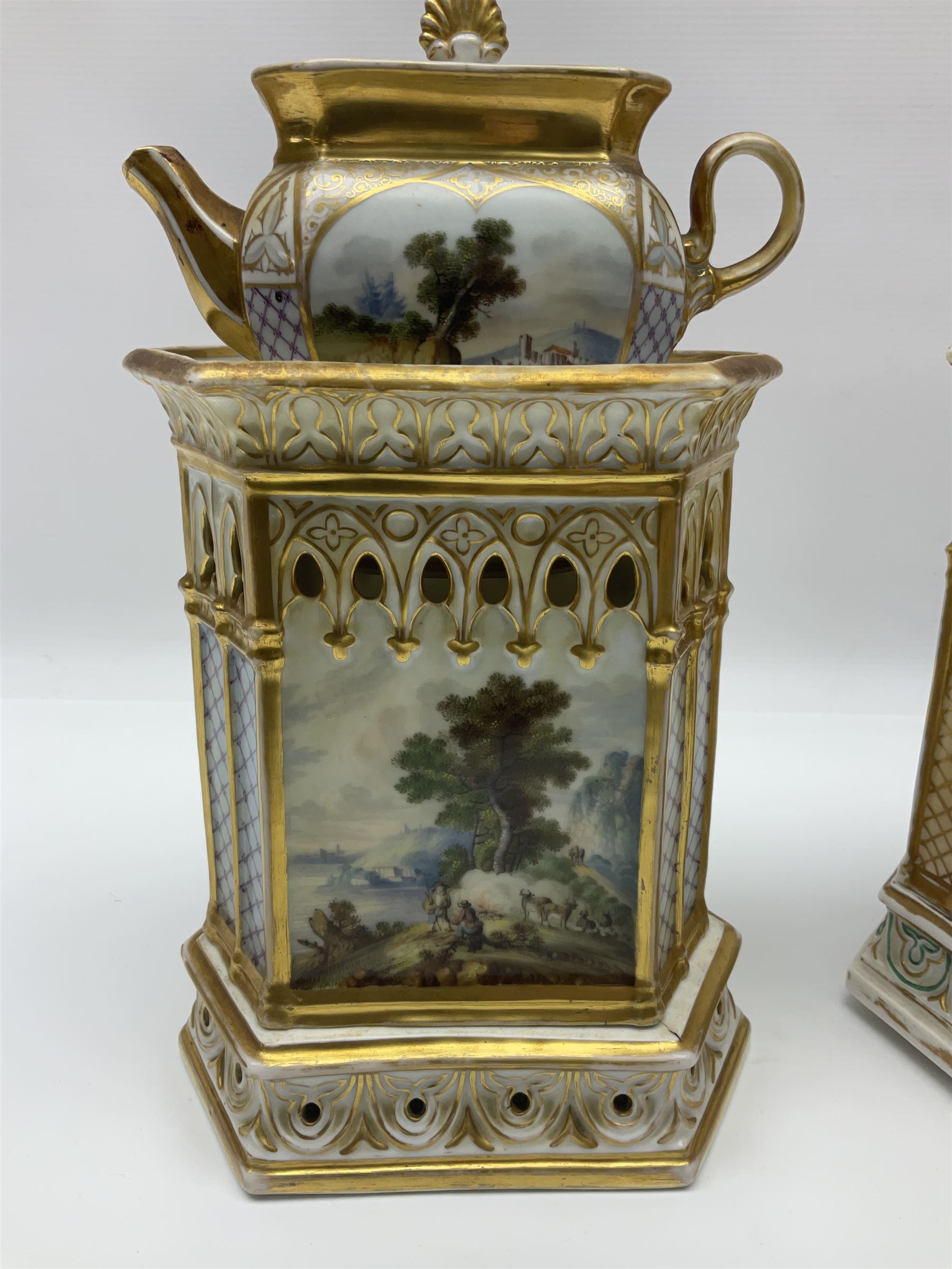 Two 19th century continental teapots and warmers, each teapot upon a hexagonal warming base, the first example painted with landscape scenes, the second with nesting birds in gilt branches, H28cm