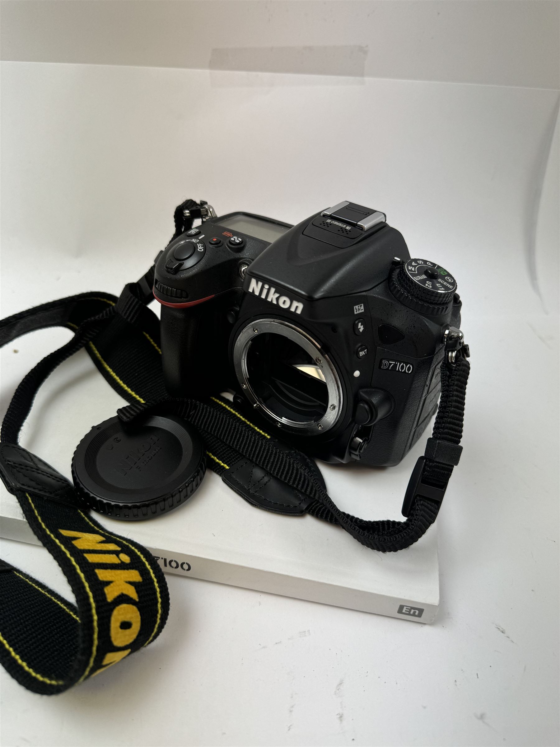 Nikon SLR D7100 camera body, serial no. 2126271, with instruction manual