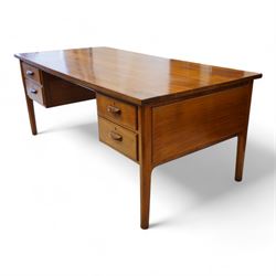 Possibly Heals of London - mid-20th century walnut kneehole desk, rectangular top over four drawers, on tapering supports 