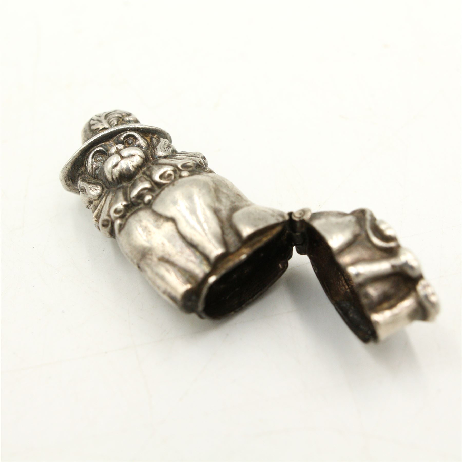 Novelty white metal vesta in the form of Punch and Judy's dog Toby, with indistinct rd. no. H5.5cm, brass matchbox holder in the form of a pig and a Victorian silver-plated horseshoe form vesta (3)