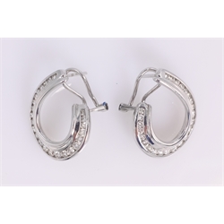  Pair of diamond white gold ear-rings, 'C' shaped channel set stamped 750  