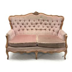 *20th century beech framed French style two seat settee, the shaped and moulded frame carved with foliate cartouche and flower heads, cabriole supports, W140cm, H99cm