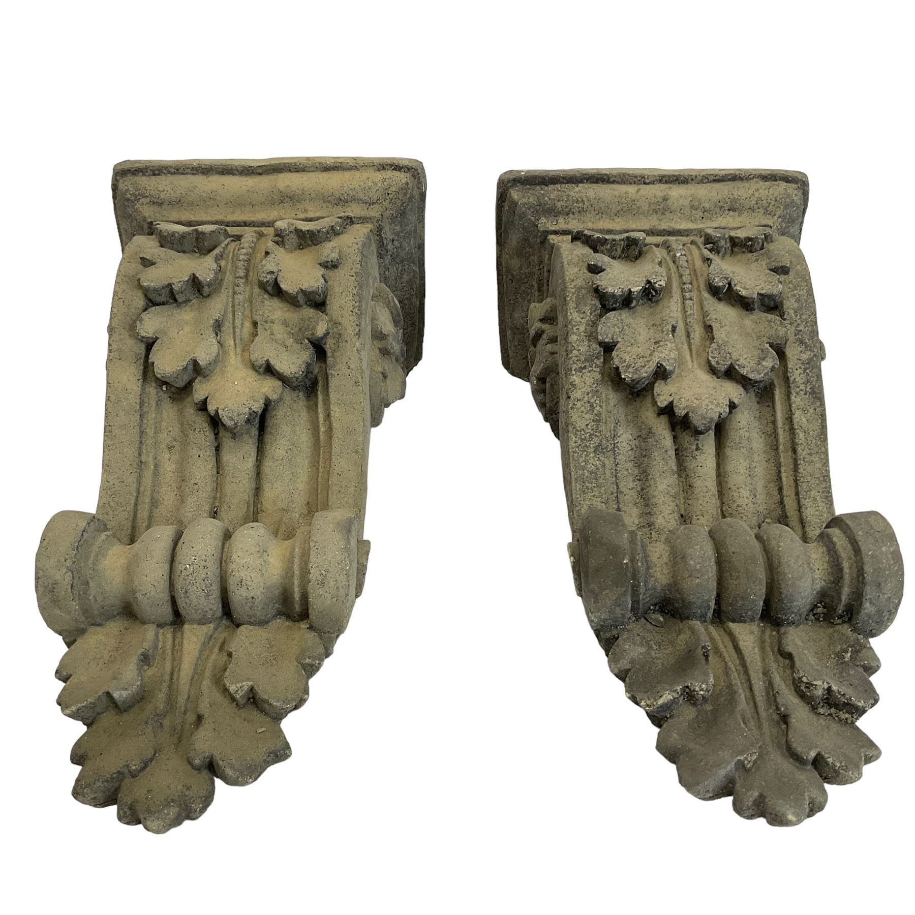 Pair of Victorian design cast stone architectural corbel wall brackets, stepped rectangular top over a scrolled bracket with relief acanthus leaf decoration and rosette motifs to the side