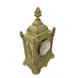 French - Brass cased 8-day mantle clock c1880, with a domed top surmounted by a pineapple finial, four reeded pilasters to the corners and raised on tapered feet, with a conforming dial with cartouche numerals, fleur-di -Lis hands and the name, Phillippe, 66 Palais Royal, Paris, twin train countwheel striking movement sounding the hours and half-hours on a bell.  With pendulum and key. 
