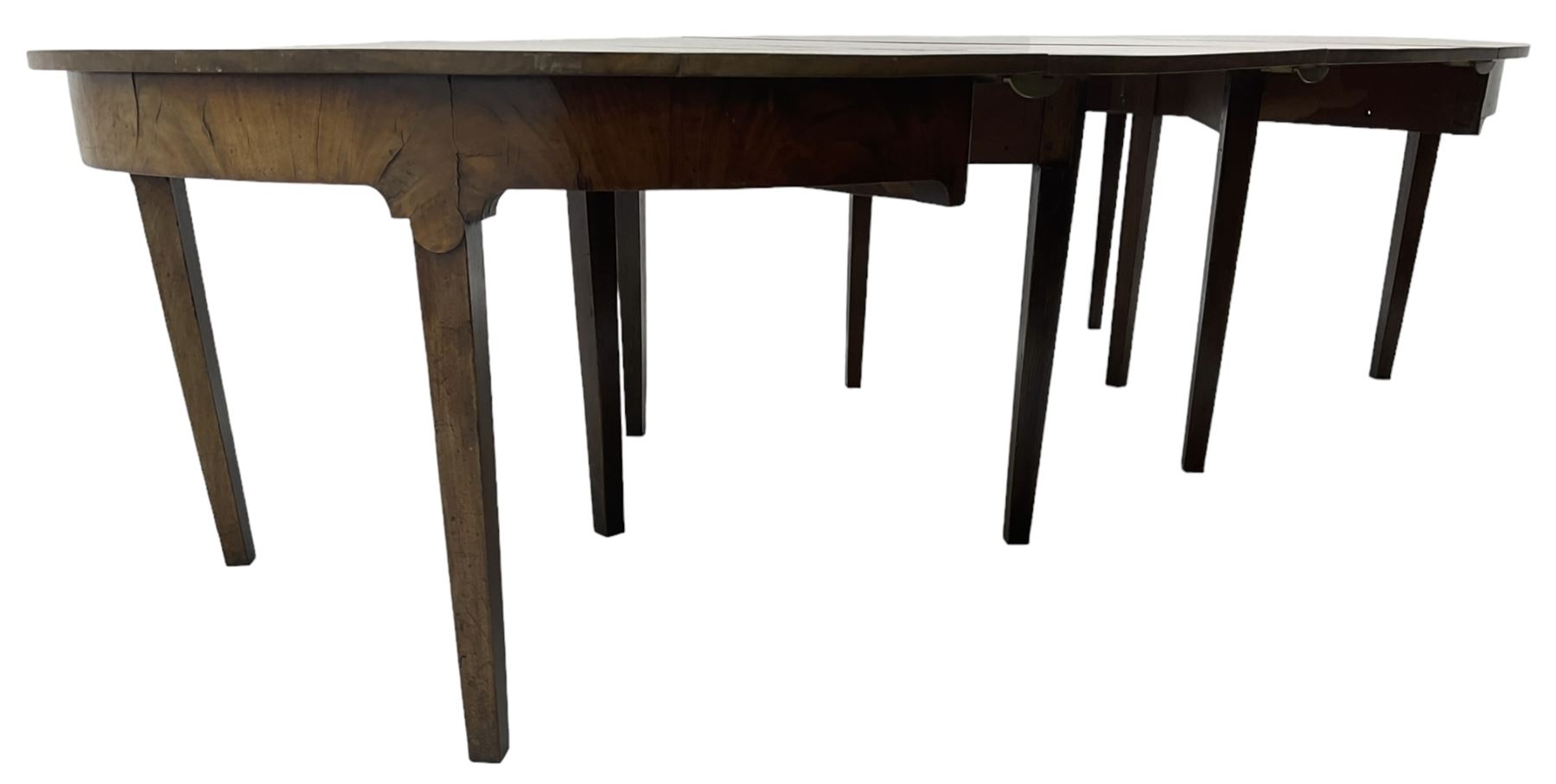 George III mahogany extending dining table, two D-ends with two leaves, on square tapering supports