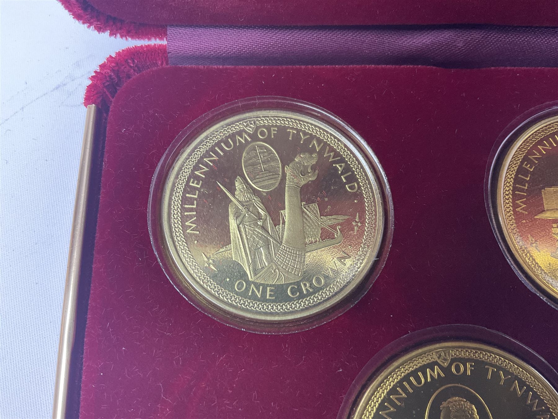 Queen Elizabeth II Isle of Man 1980 'Commemorating the 1980 Olympics' silver proof crown four coin set and 1979 '1000th Anniversary of Tynwald' silver proof crown five coin set, both sets cased with certificates 