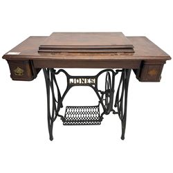 Early 20th century Jones treadle sewing machine table, bevel edged rectangular top with hinged lid enclosing sewing machine no. 480760, supported by cast iron treadle base