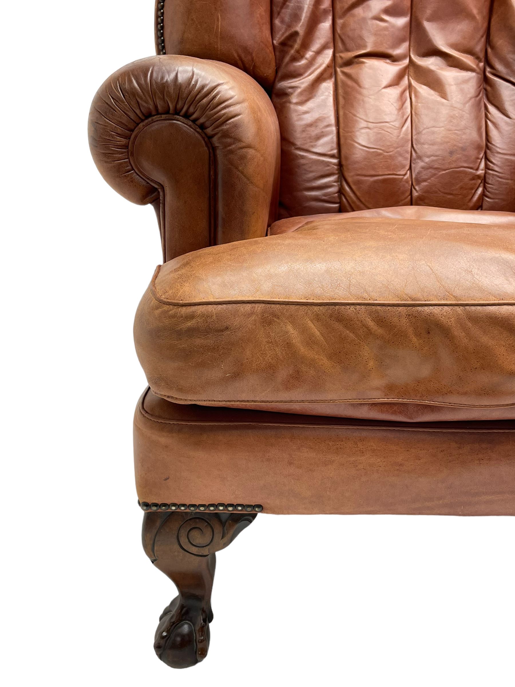 Tetrad - 'Blake' club armchair, fanned wingback and rolled arms upholstered in tan brown leather, on ball and claw carved cabriole feet 