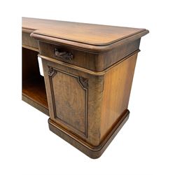 Mid-19th century figured mahogany sideboard, moulded reverse-break front, fitted with three drawers and two cupboards, carved faux bois handles, enclosed by panelled doors with book-matched veneers, applied geometric mouldings and scroll leaf decoration, on moulded plinth base 