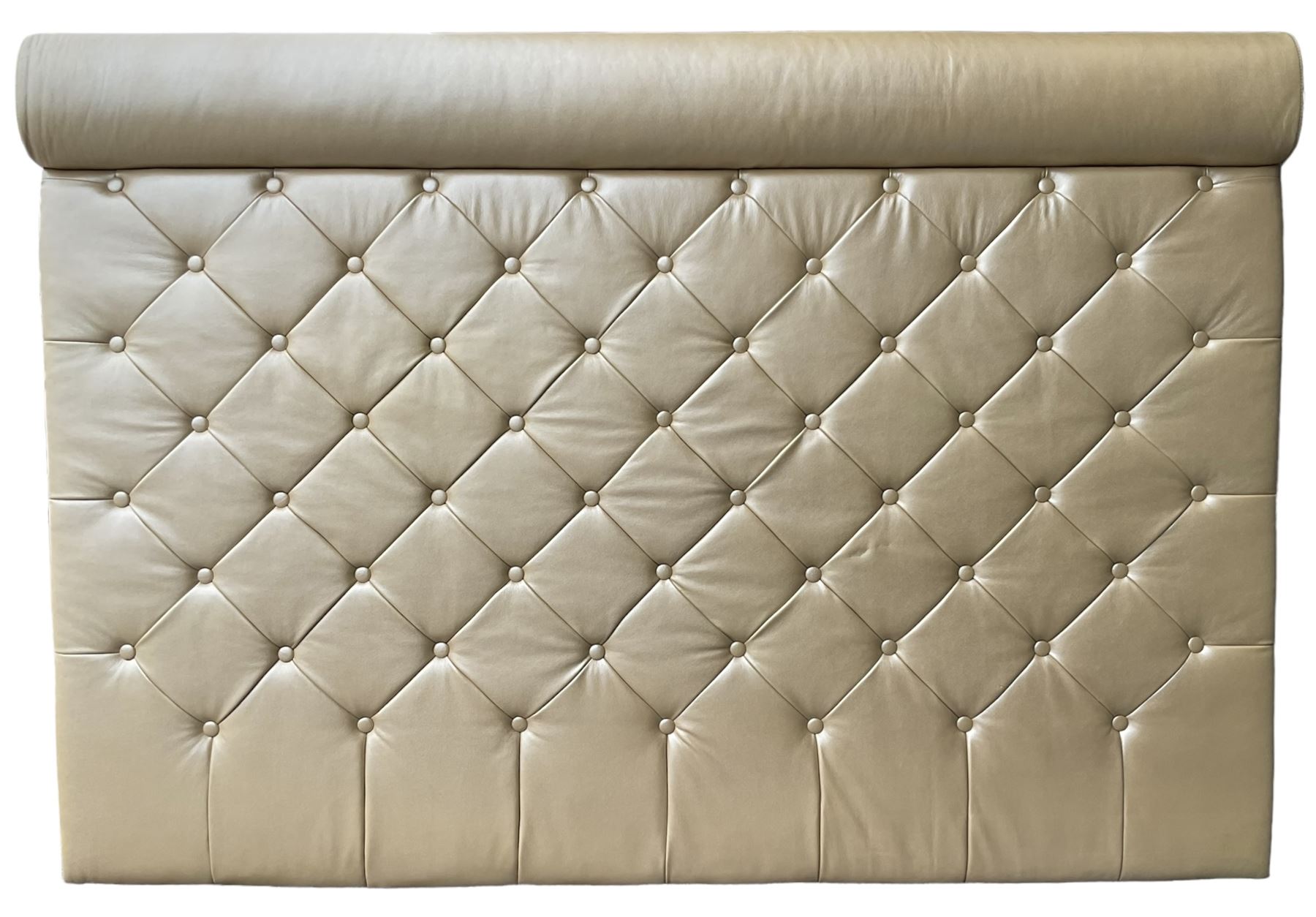 Large padded headboard, upholstered in beige buttoned faux leather