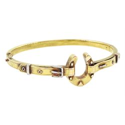 Early 20th century gold horseshoe and buckle hinged bangle, stamped 15ct