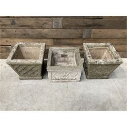 Pair of square cast stone planters, single planter with leaf decoration and a rectangular brick effect planter (4)