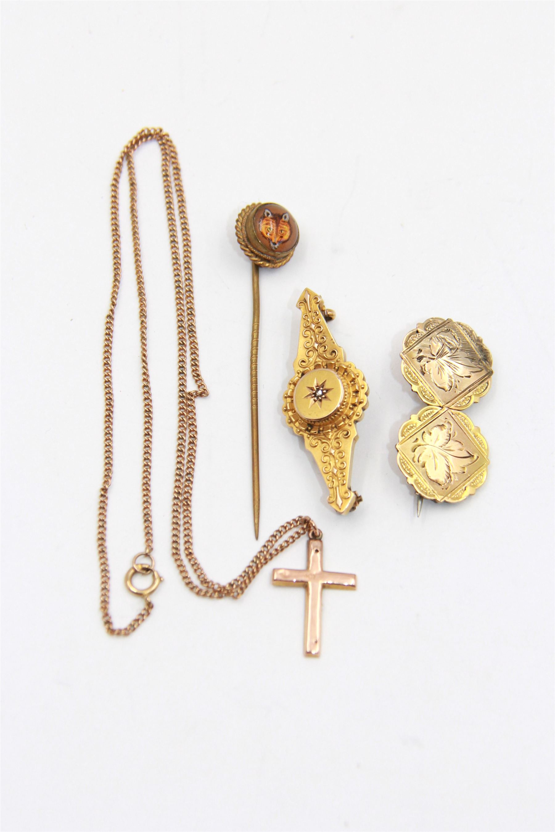 9ct rose gold cross pendant necklace and a 9ct gold sweetheart brooch with leaf decoration, together with a 15ct gold front and back brooch and a yellow metal Essex crystal fox stick pin