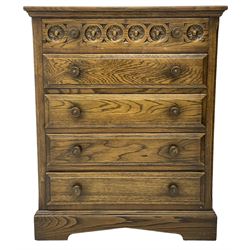 Mid-20th century oak chest, fitted with five drawers, the top drawer carved with flower head roundels, on bracketed plinth base 