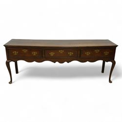 18th century oak dresser base, rectangular top over three cock-beaded drawers, shaped apro...