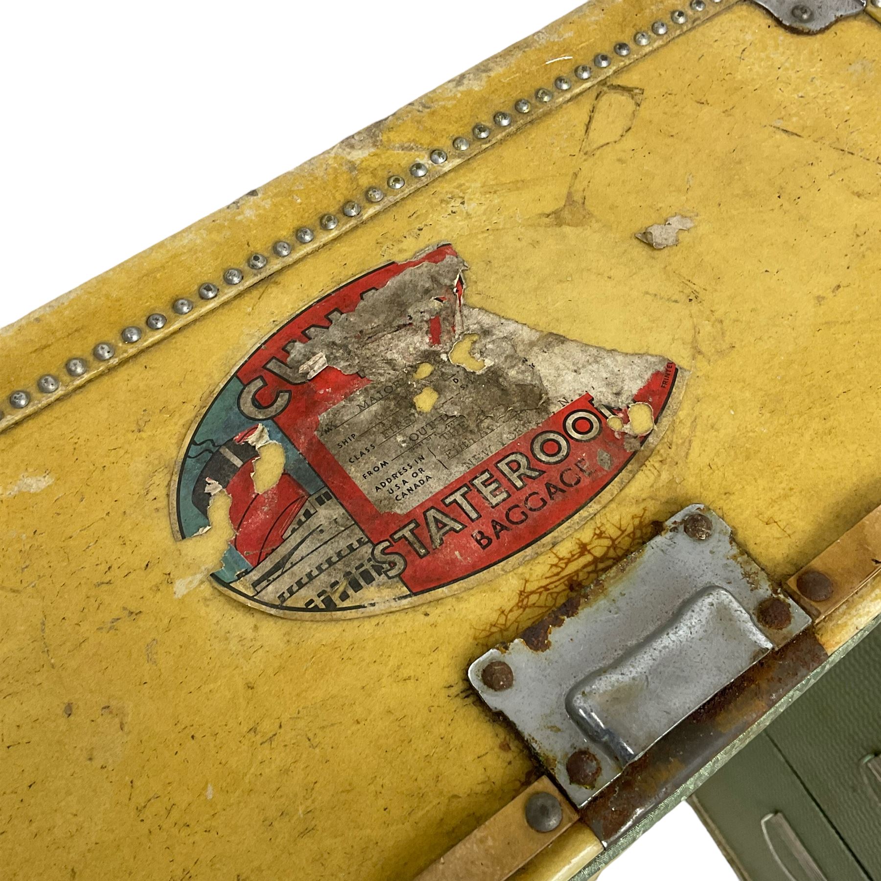 Early 20th century steamer traveling trunk, in yellow finish with chrome fixtures, the interior fitted with drawers and hangers, with various travel labels 