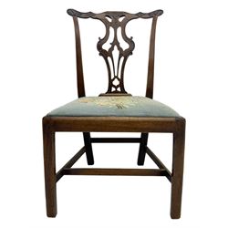 George III Chippendale design dining chair, shaped cresting rail carved with foliate scrolls over pierced and carved splat, floral needle-work upholstered drop-in seat, on square moulded supports united by H-stretchers 