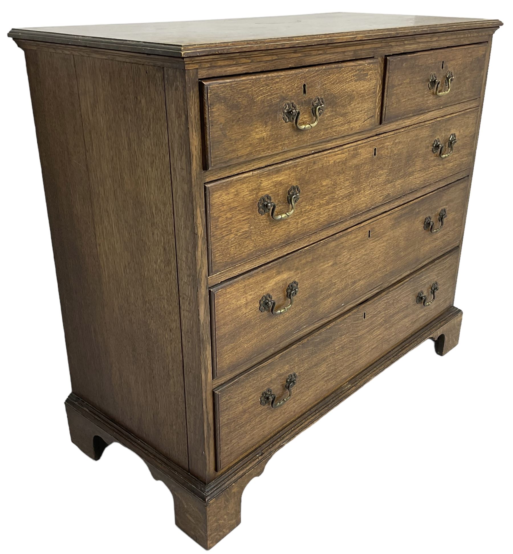 Early 20th century Georgian design oak chest, fitted with two short over three long drawers, lower moulded edge over bracket feet