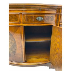 Wade - Georgian design yew wood bow-fronted sideboard, projecting moulded top over four cockbeaded frieze drawers, the central two with pull-out slides, four cupboards below with figured veneers, raised on bracket feet