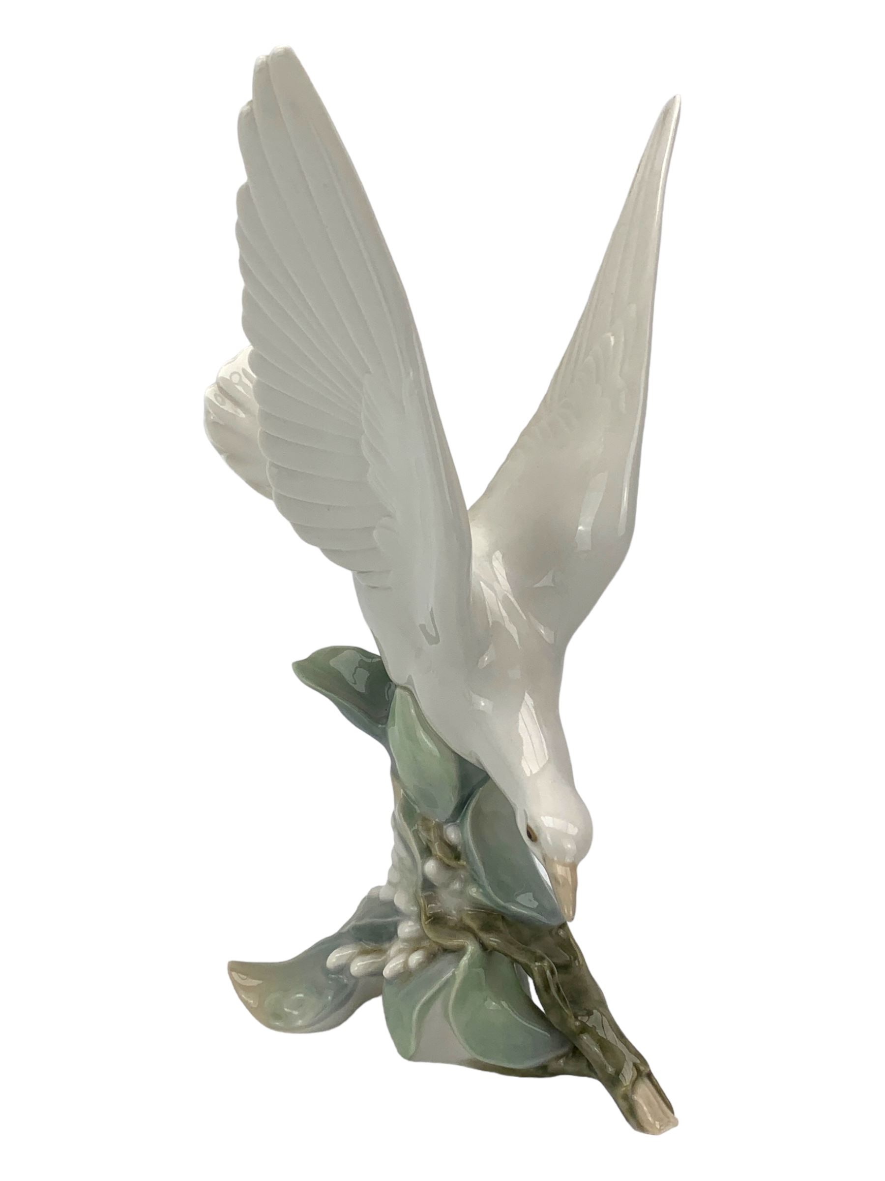 Seven Lladro figures including group of two doves, rooster, boy with accordion, deer, dove in flight , two geese and two Nao figures