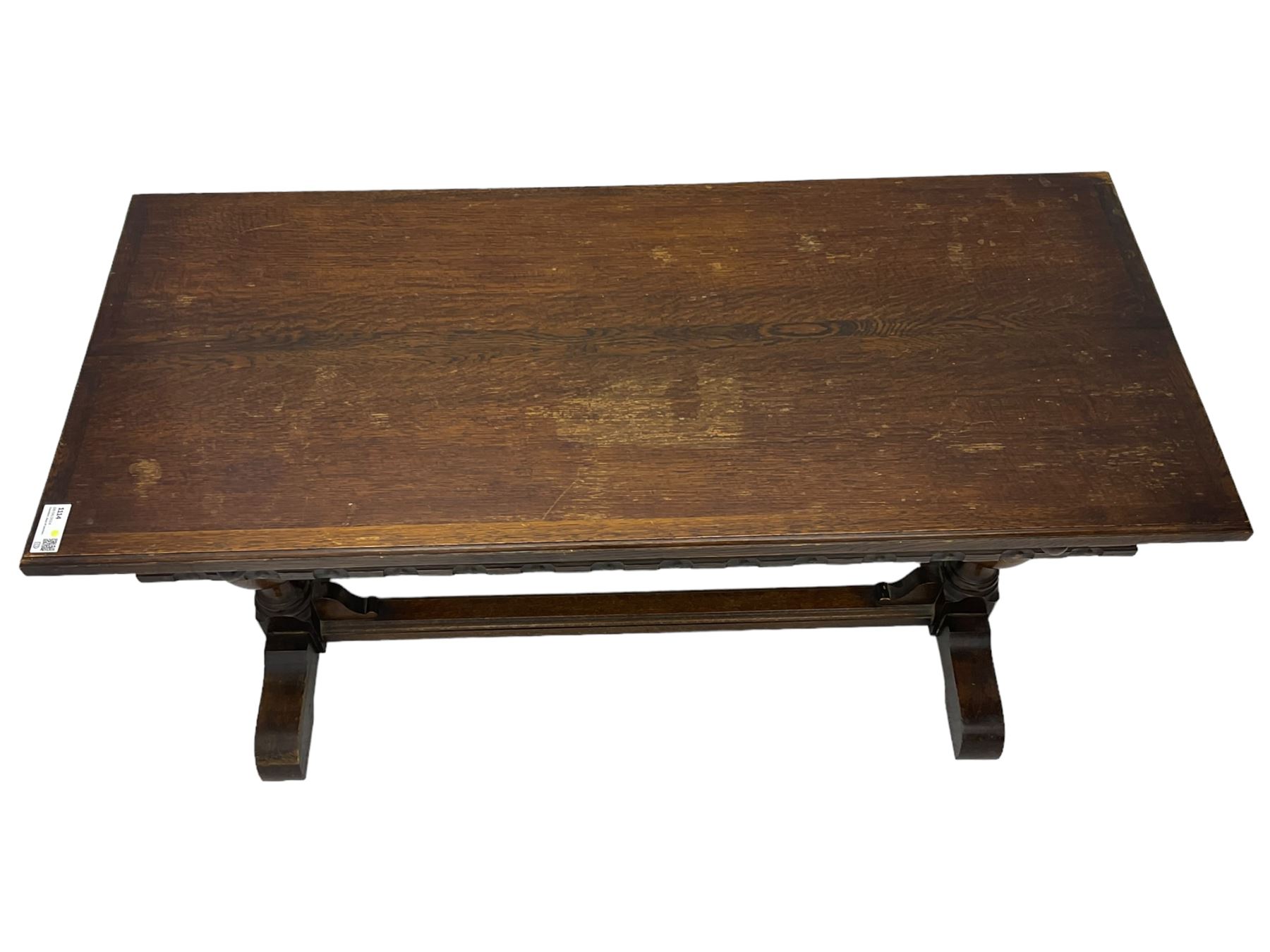 Early 20th century oak extending table, moulded rectangular top, pull-out action with fold-out leaf, on turned cup and cover pedestals and sledge feet, united by moulded stretcher 