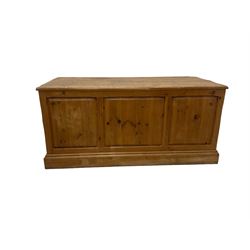 20th century waxed pine kneehole desk, rectangular top over nine drawers with cup handles, on moulded plinth base