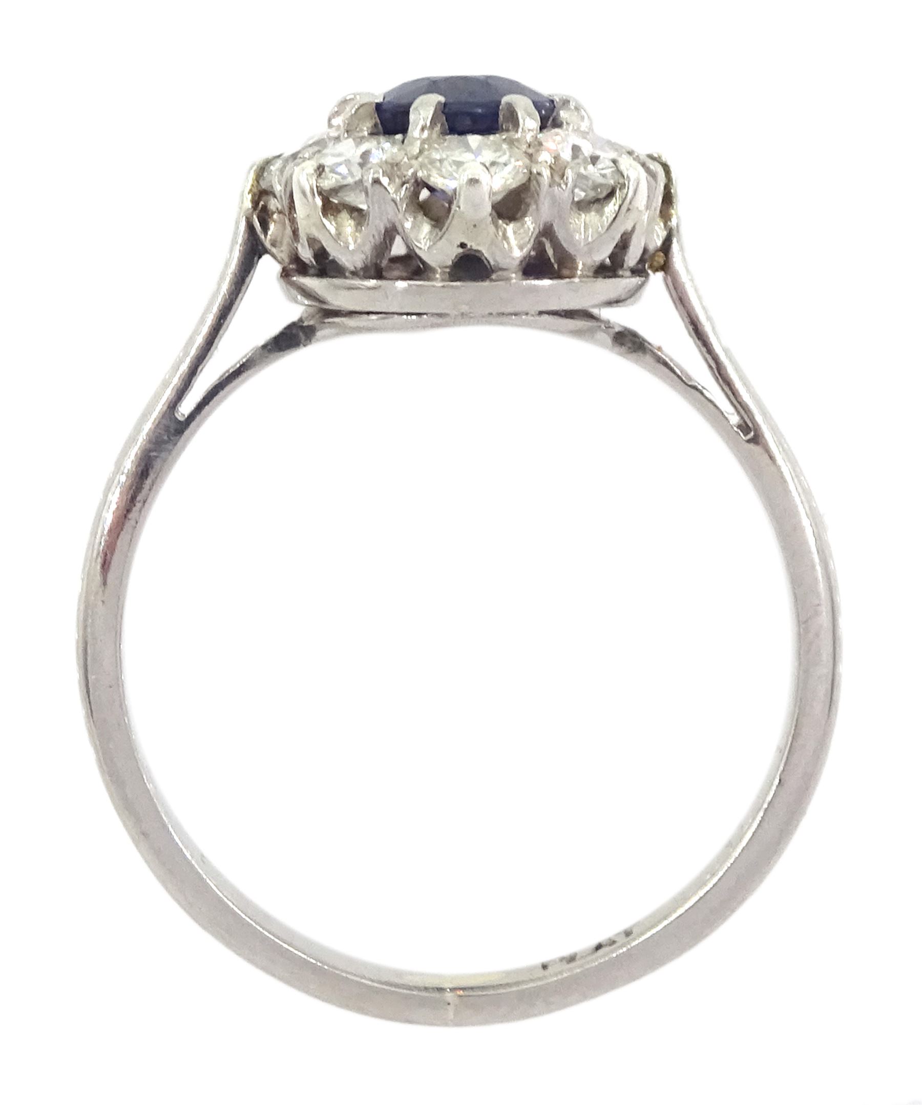 Platinum oval cut sapphire and transitional cut diamond cluster ring, stamped Plat, sapphire approx 0.70 carat, total diamond weight approx 0.80 carat