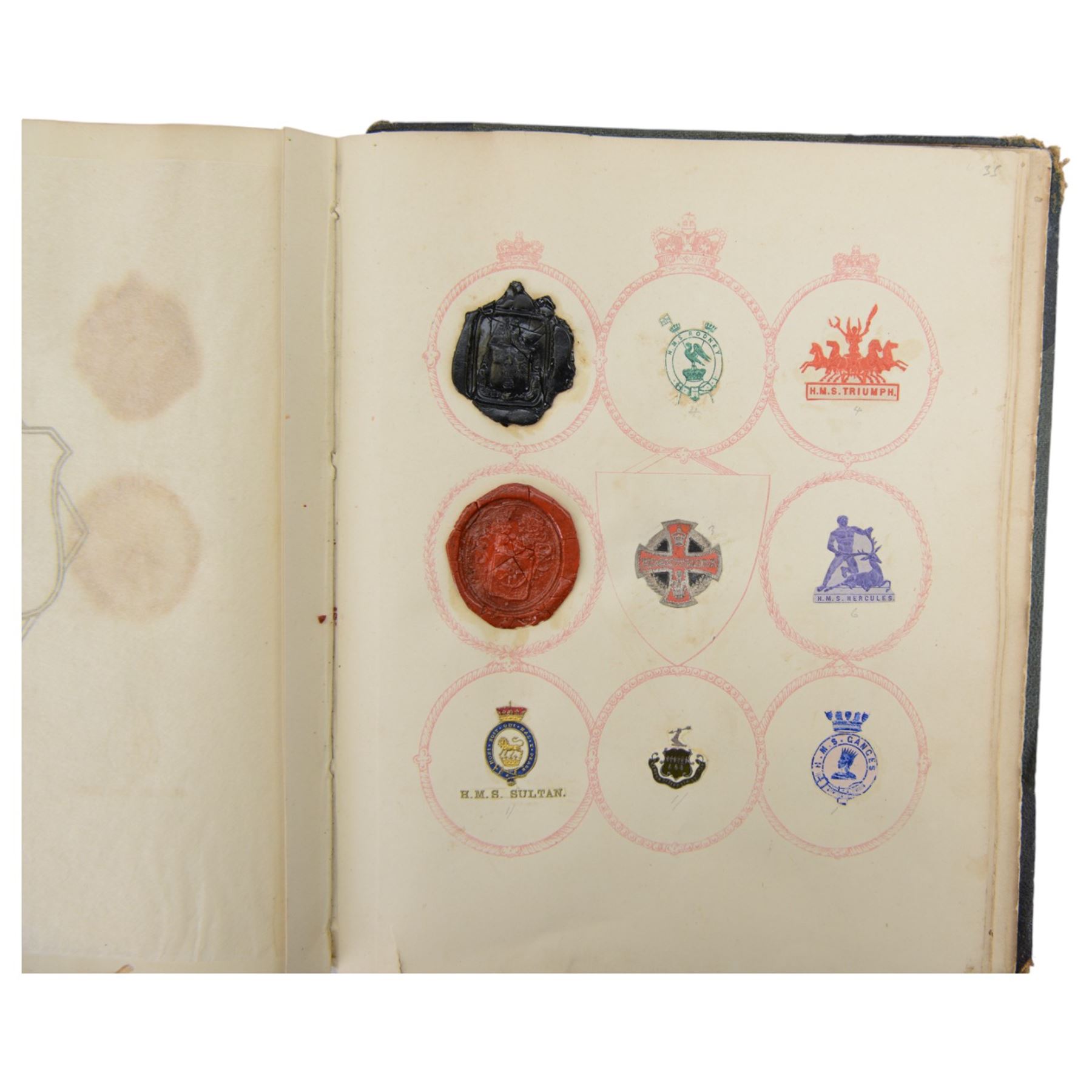 Victorian album of crests and monograms, including examples cut from envelopes and stamped into wax seals, with label to interior front cover reading 'Edward Law's Crest Collection Album 243' 