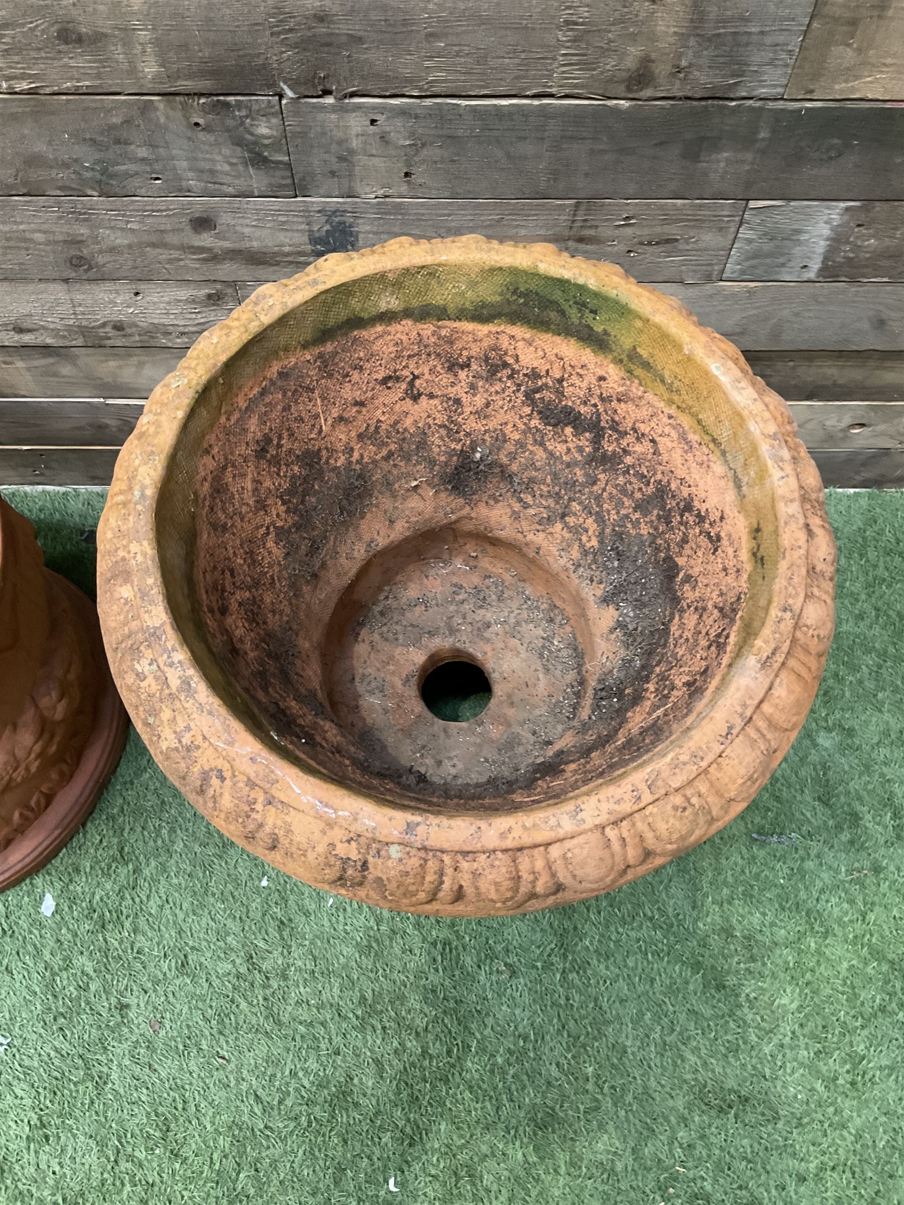 Circular terracotta garden planter, decorated with cherubs and terracotta urn on plinth - THIS LOT IS TO BE COLLECTED BY APPOINTMENT FROM DUGGLEBY STORAGE, GREAT HILL, EASTFIELD, SCARBOROUGH, YO11 3TX