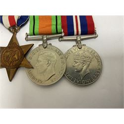 WWII group of six medals comprising 1939-45 Star, The Africa Star, The Italy Star, France and Germany Star, Defence Medal and War Medal 1939-45, awarded to 7899181 RAC C.W Hughes, together with two chevrons and ephemera relating to Charles William 'Bill' Hughes including Soldier's Release Book, photographs, certificates of transfers etc 