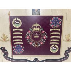 Commemorative Military needlework, headed 'VII Princess Royal's Dragoons Guard, the central flag has the regimental title, surrounded by a Union wreath of roses, thistles and shamrocks, topped with a crown, the Hanoverian white horse features in two corners, framed H58cm, L73cm