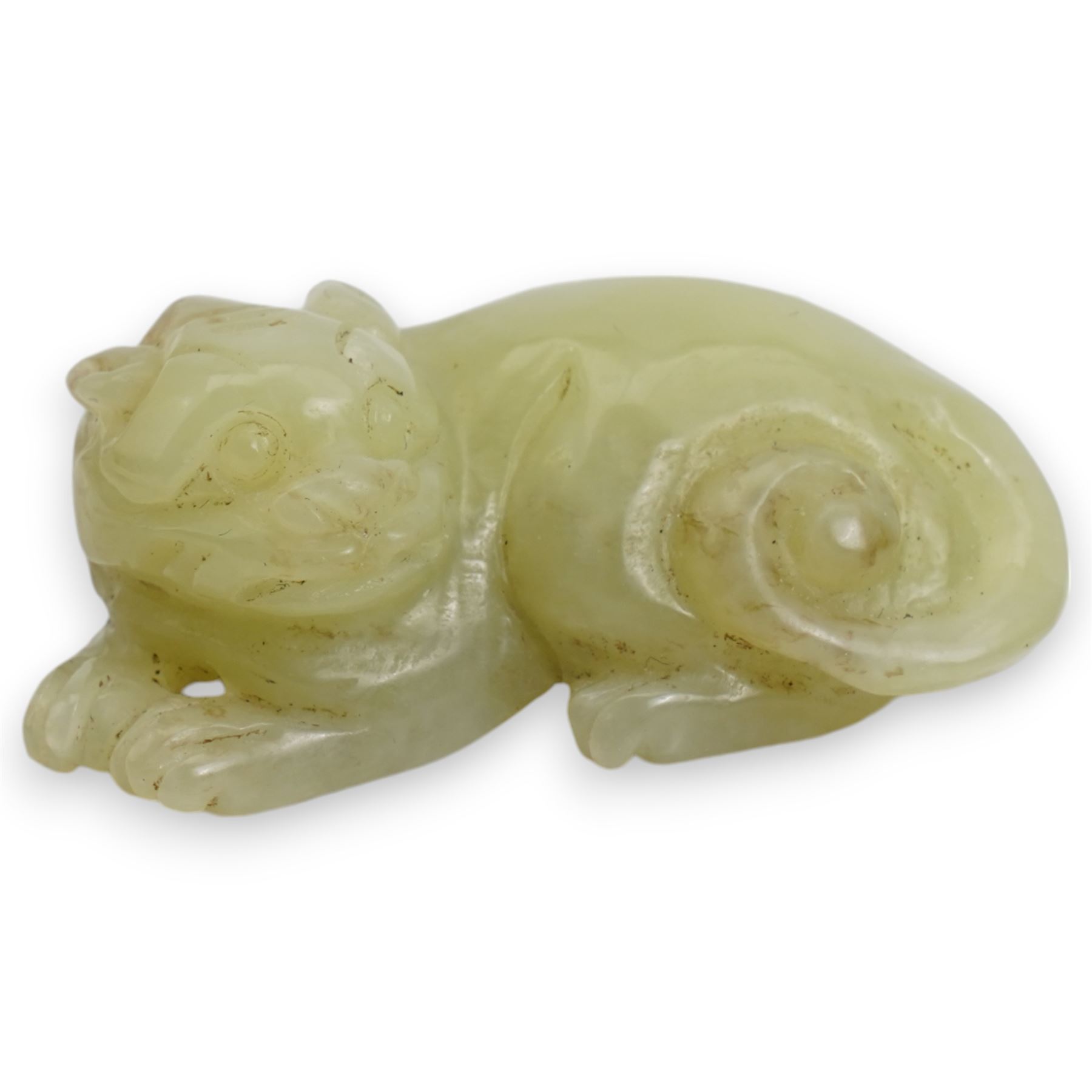 Small Chinese carved jade model of a tiger, modelled in a crouching position, 4.3cm long