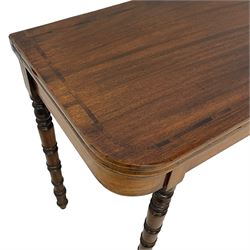 Early 19th century mahogany tea table, rectangular fold-over top with rounded corners, inlaid with mahogany banding, the plain frieze with mahogany stringing, raised on gate-leg action ring turned supports