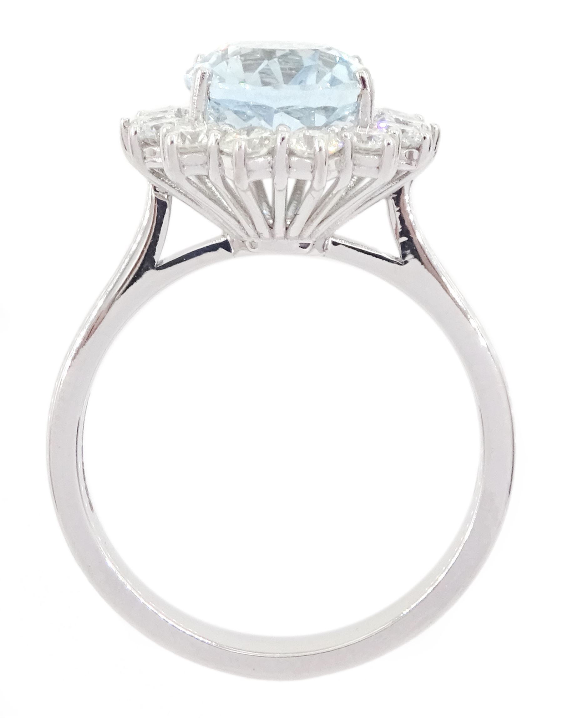 18ct white gold oval cut aquamarine and round brilliant cut diamond cluster ring, hallmarked, aquamarine approx 2.55 carat, total diamond weight approx 0.80 carat