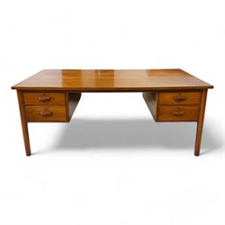 Possibly Heals of London - mid-20th century walnut kneehole desk, rectangular top over four drawers, on tapering supports 