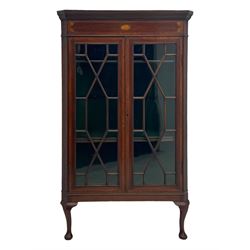 Edwardian mahogany corner cabinet, projecting cornice over inlaid frieze, two astragal glazed doors enclosing shelved interior, on cabriole supports