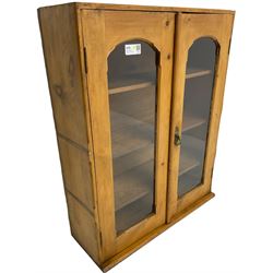 19th century waxed pine cabinet, two glazed doors enclosing adjustable shelves