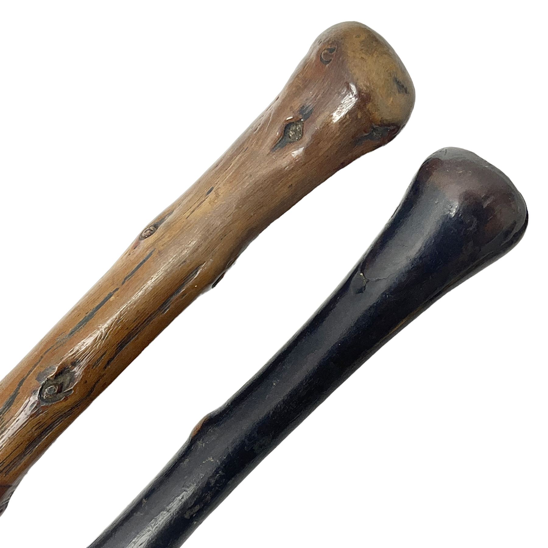 Two wooden walking sticks, both with comparts that would have housed horse measures, H88cm