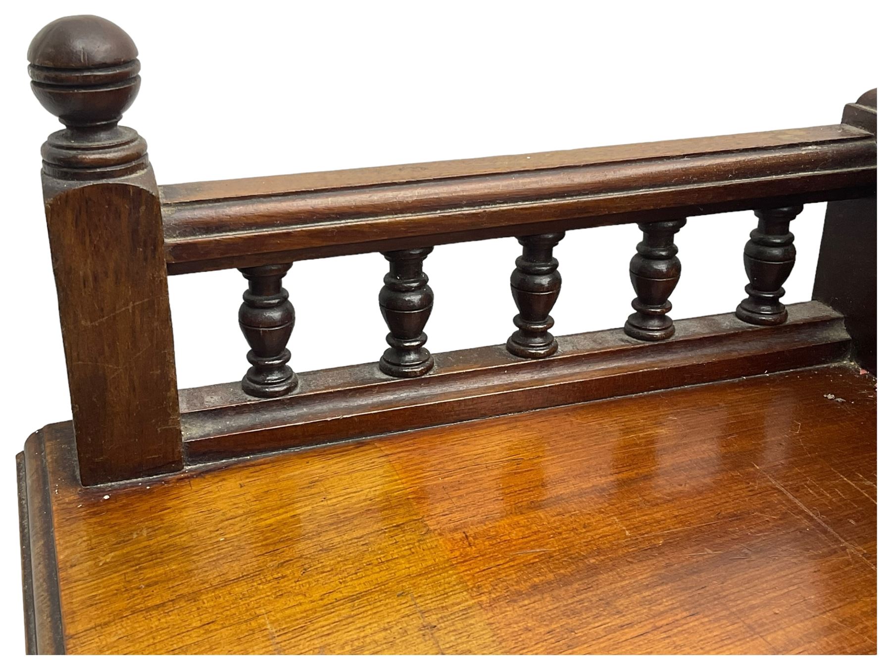 Victorian walnut clerk's desk, raised central section with tambour roll over hinged top, the interior fitted with leather inset writing surfaces, small drawers, document divisions and pen and ink stand, central drawer over double panelled cupboard, flanked by two banks of four graduating drawers, on bracket feet 