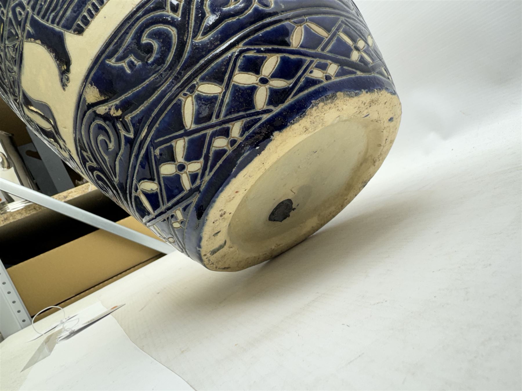 Pair of blue and white Cretan style vases, decorated with figures among trees with blue boarders on a white ground, H55cm