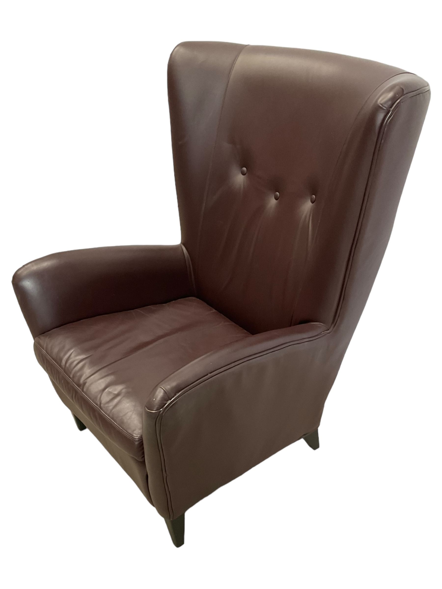 Wing back armchair upholstered in cocoa brown leather