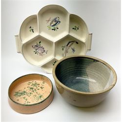 A Poole pottery hors d'oeuvres dish decorated with fish and shrimps in pastel colours D30.5cm, with a large studio pottery bowl with internal decoration D22cm and a studio pottery deep dish with orange and green decoration D7cm.