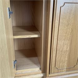 Light oak breakfront sideboard dresser, fitted with four drawers and four cupboards