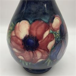 Moorcroft Anemone pattern vase of baluster form, upon a blue ground, with painted and impressed marks beneath, H24cm