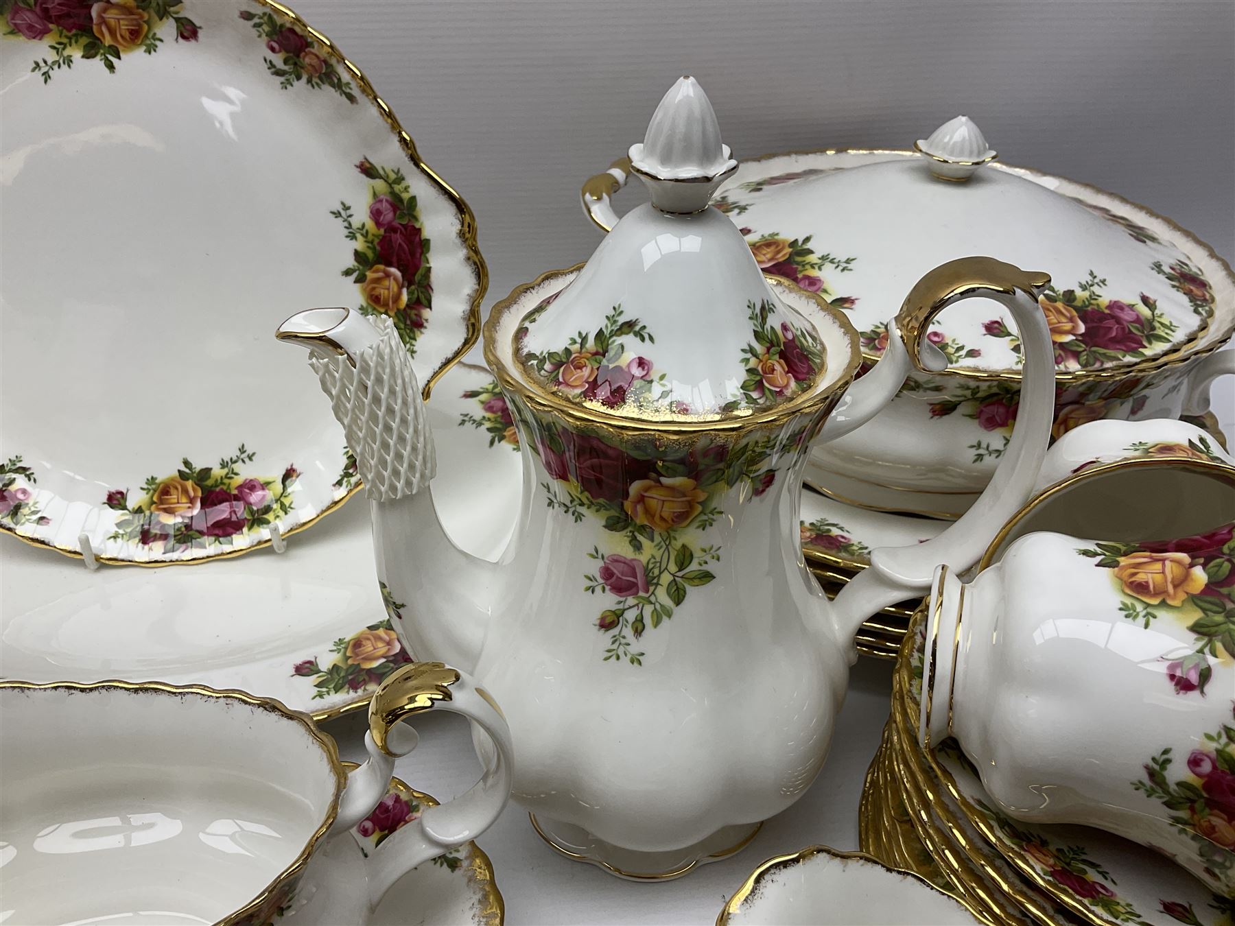 Royal Albert Old Country Roses pattern tea and dinner service, including teapot, coffee pot, two milk jugs, two open sucriers, six teacups and saucers, six dinner plates, six soup bowls, etc  