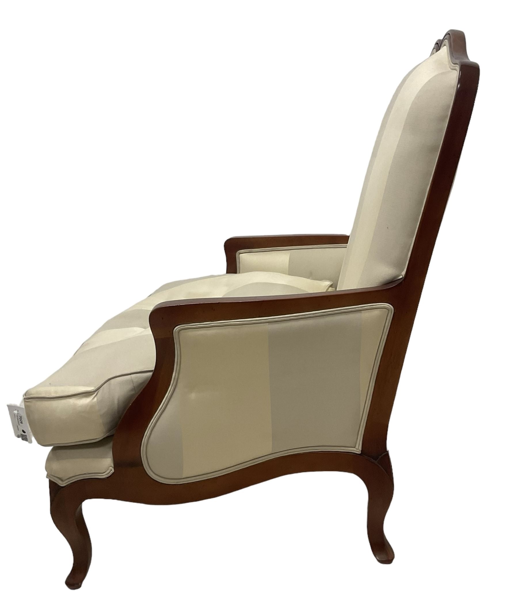 Duresta - French design hardwood-framed wide-seat armchair, shaped cresting rail over curved arms, upholstered in two-tone off-white striped fabric with loose seat cushion, shaped apron and cabriole feet 