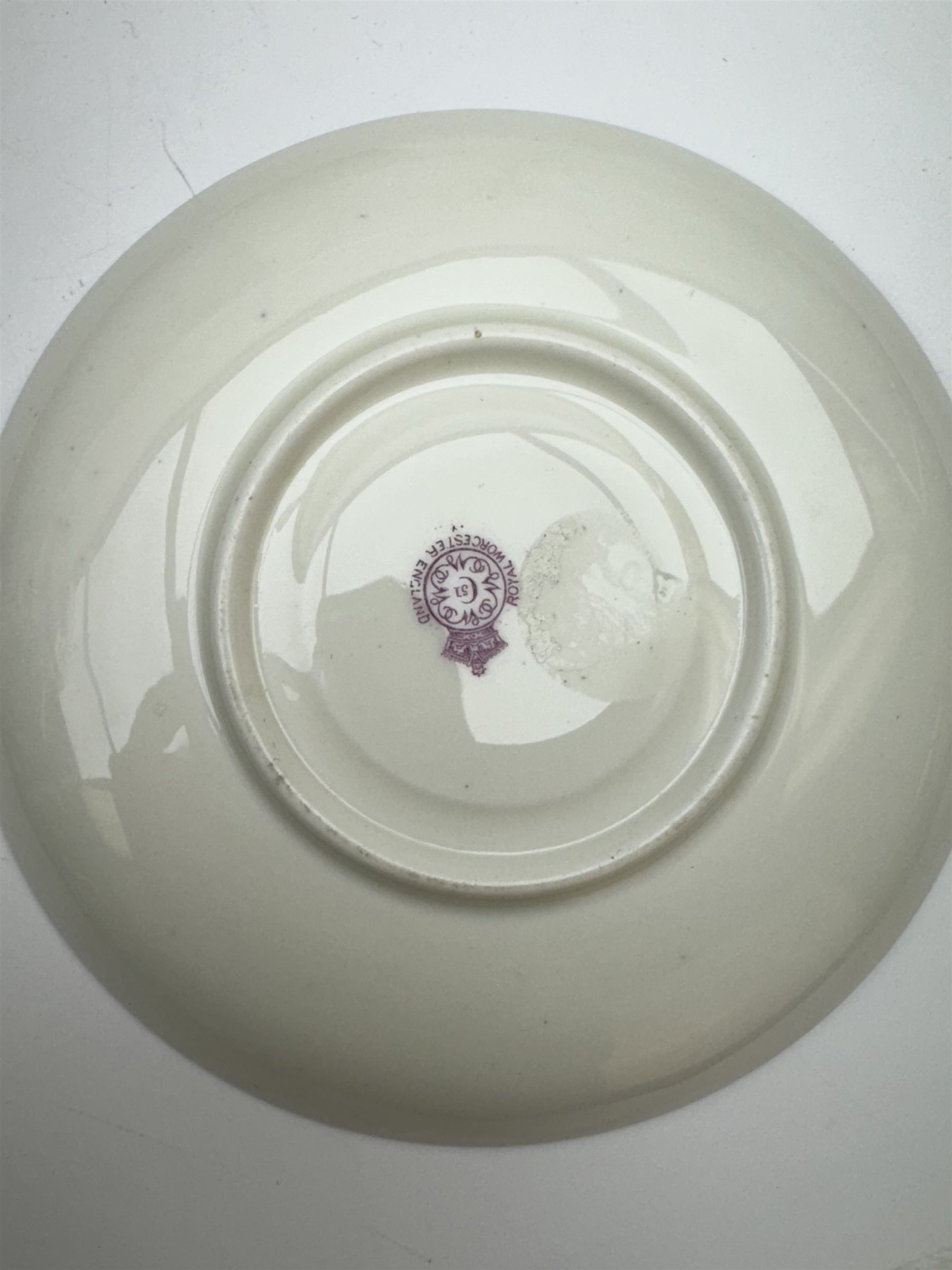 Early 20th century Royal Worcester cup and saucer decorated by Thomas Lockyer, the interior of the cup and the saucer decorated with fruit to a mossy background, with puce printed mark beneath 