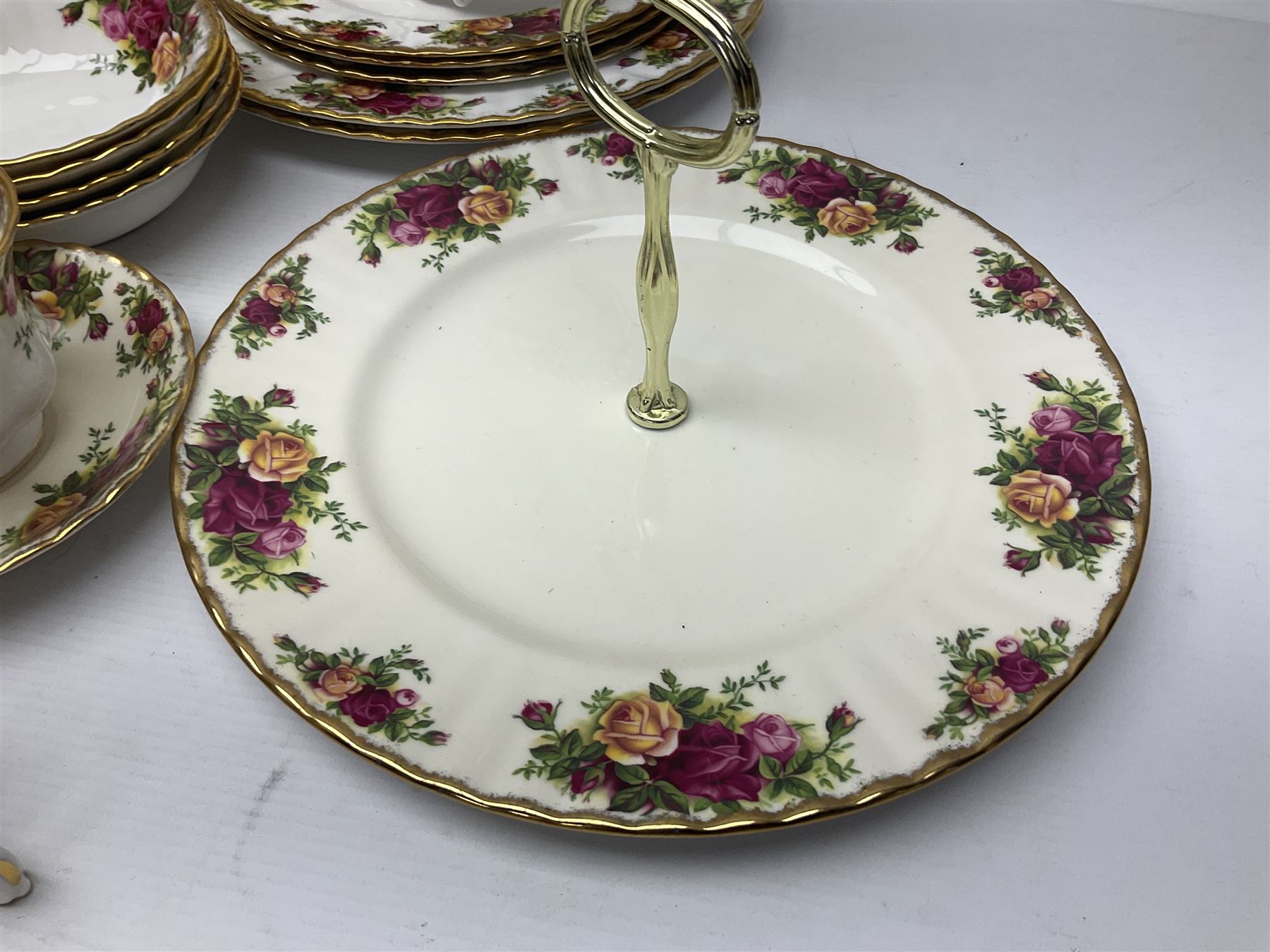 Royal Albert Old Country Roses pattern coffee set for four, comprising coffee pot, milk jug, cups and saucers, cake plate, together with six dinner plates, side plates etc (34) 