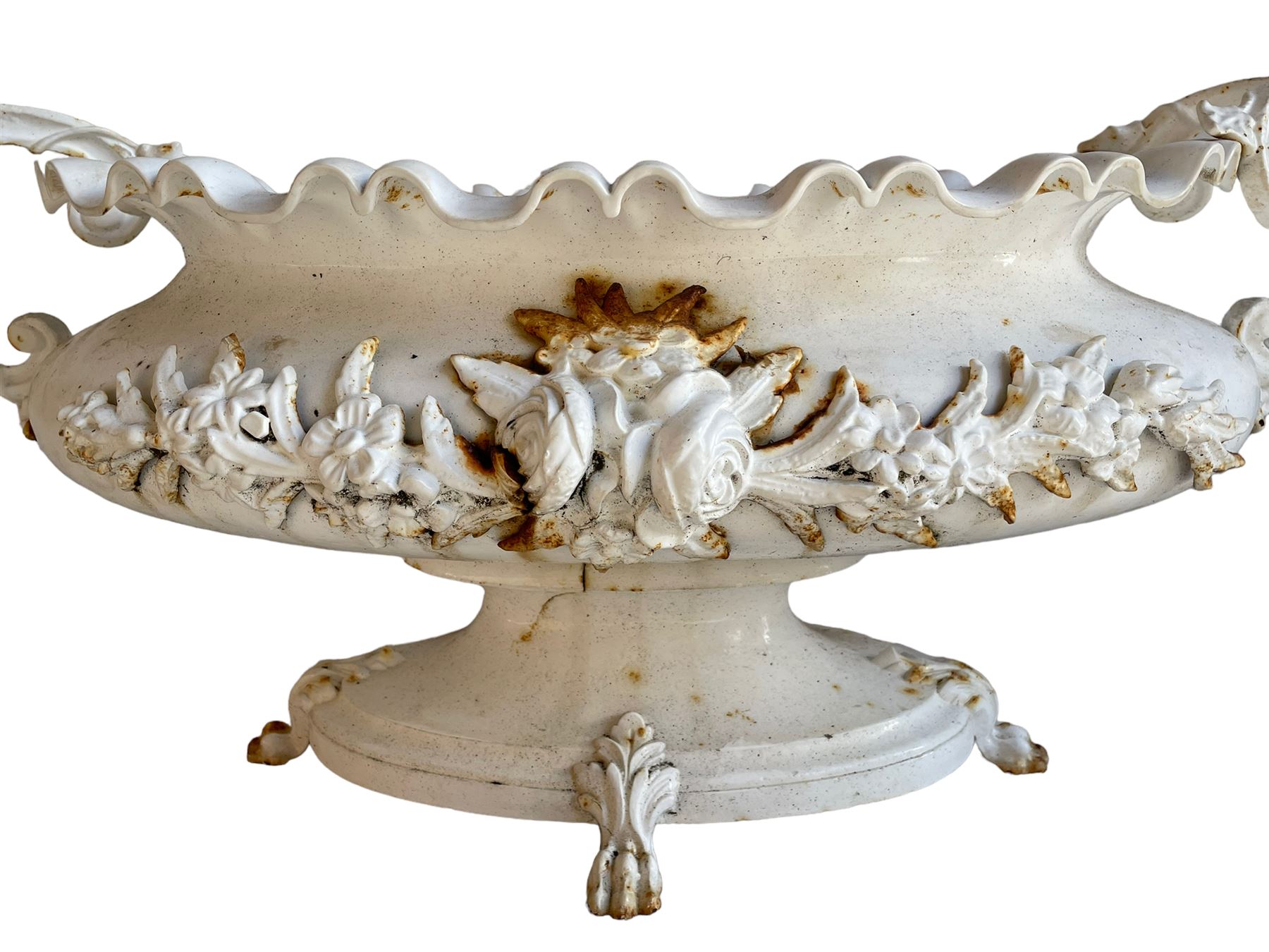 Corneau Alfred á Charleville - mid-19th century French cast iron planter, swollen and waisted oval form with scalloped upper rim, scrolled and ivy leaf cast handles, the front mounted by extending floral casting, on oval footed base with foliage and paw cast feet, the interior with drainage holes, inscribed 'Corneau Alfred á Charleville No 3' 