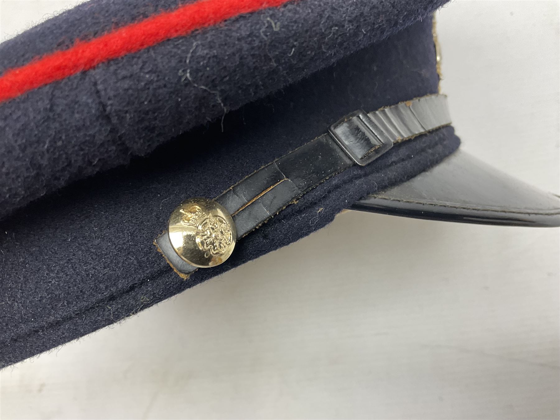 Five military caps/berets comprising two peaked caps with 'Yorkshire' and 'Royal Engineers' badges; maroon beret with parachute regiment badge; red beret with Military Police badge; and AB seaman hat with HM Submarines band; and a felt and webbing covered water bottle (6)